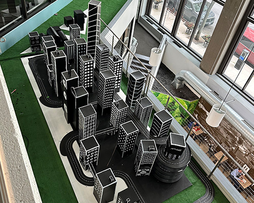 Anything is Possible installation Overhead view of the art piece that features several buildings and roads in 4D.